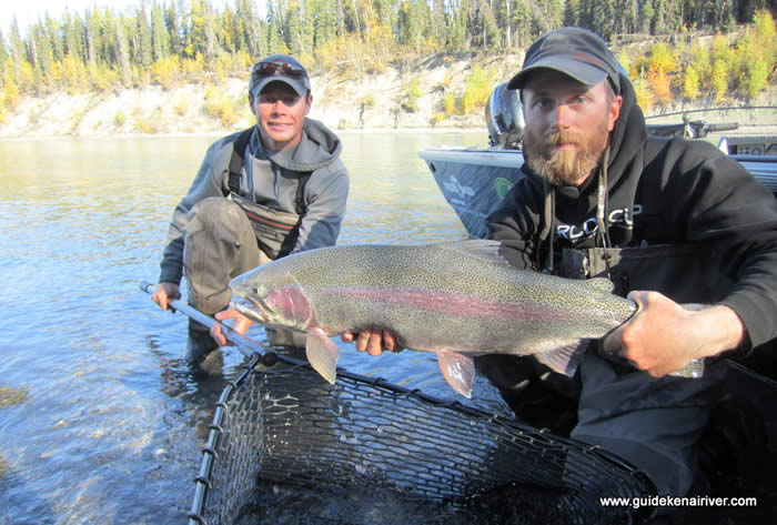 Two anglers posing with a Trophy Kenai River Rainbow Trout