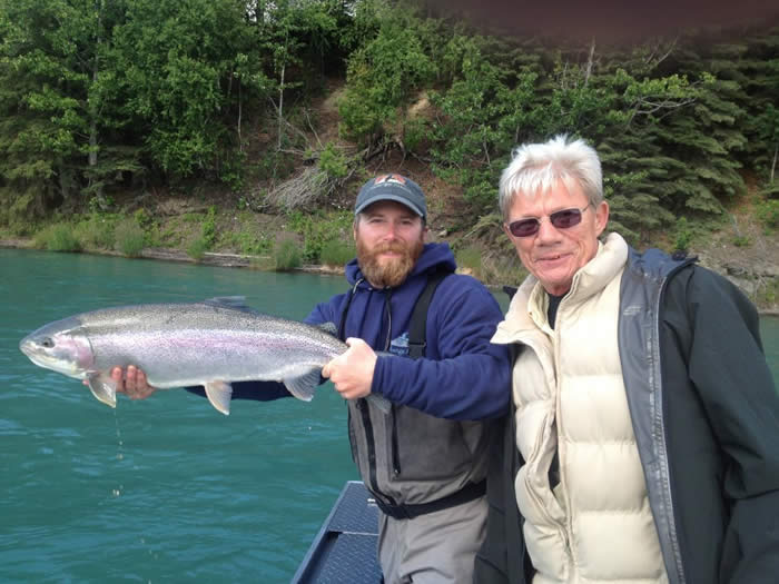 guide and client holding trophy kenai trout in early August