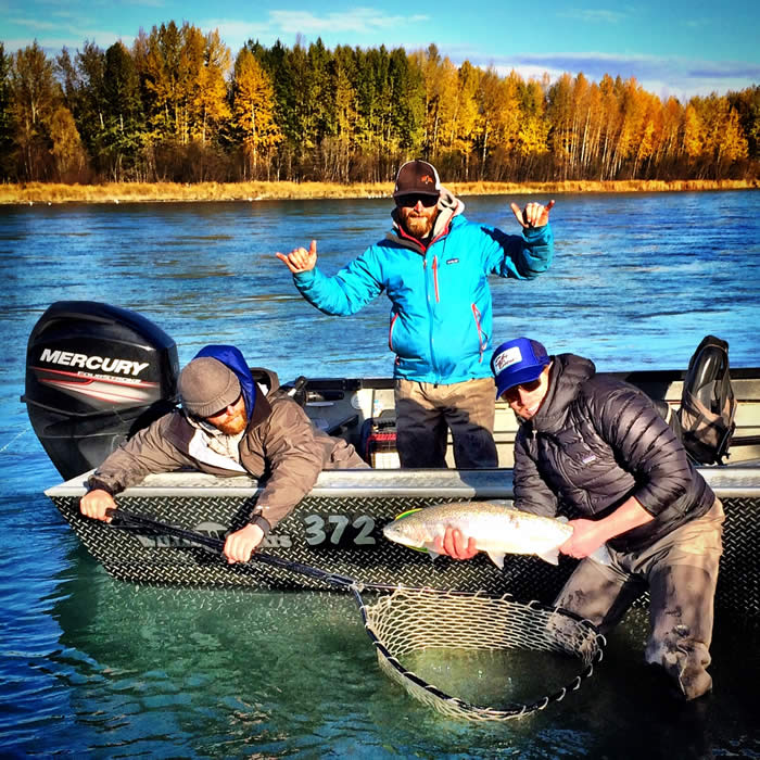 Jeremy and Nick with angler holding Kenai River Steelhead on a sunny September day