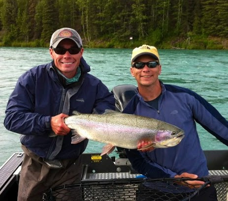 Auugst Kenai River Trophy Rainbow Trout. Guide and Happy client holding Trout